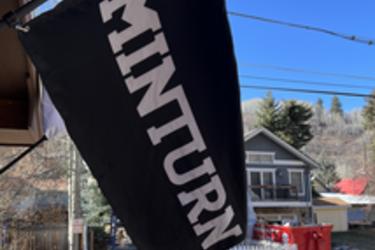 Black flag with white Minturn lettering.