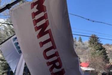 White flag with red Minturn lettering.
