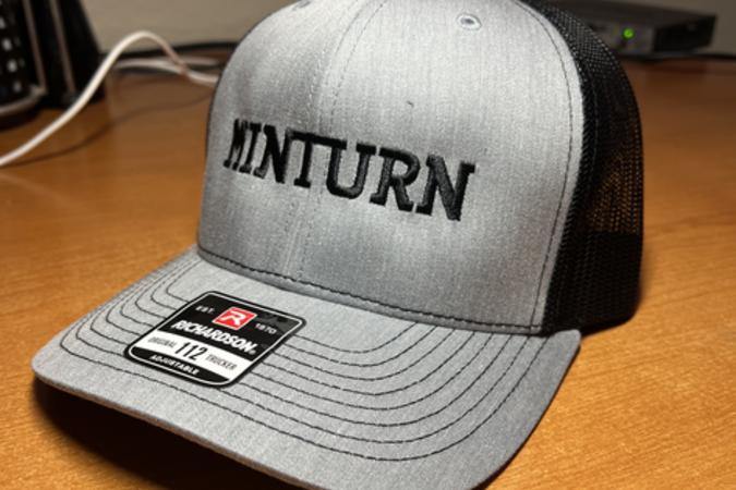 Gray hat with black Minturn lettering.